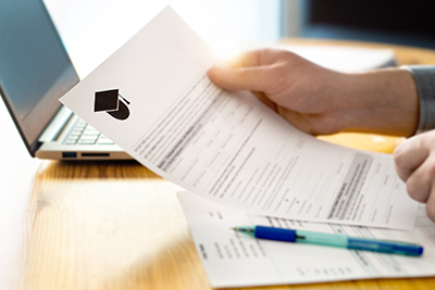 An image of a borrower reviewing a financial aid award letter.